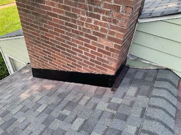 New chimney counter-flashing detail on an architectural shingle roof