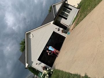 Vinyl siding and shingle roof completed ahead of storm season on a Wichita home