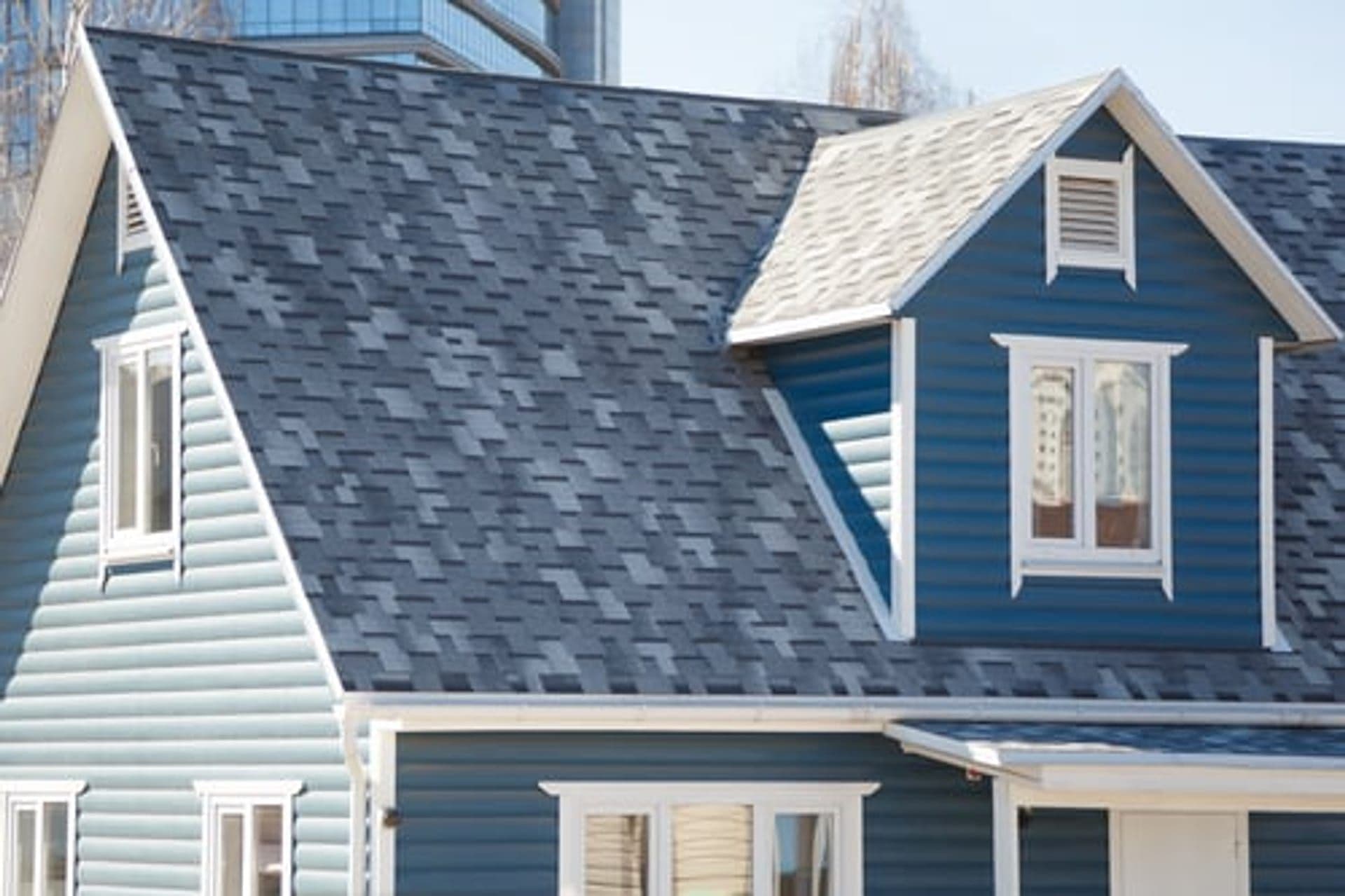 Wichita home with a newly installed architectural shingle roof by Global Roofing and Construction